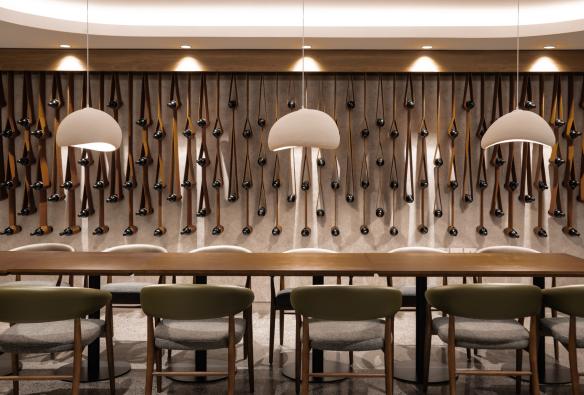 The Restaurant at Mount View Estate with contemporary lighting and wine bottle wall design. © Mount View Estate