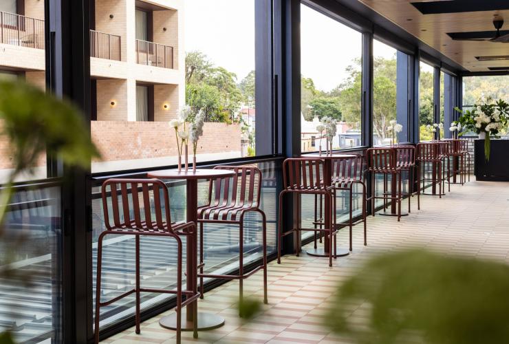 The undercover, open air terrace with tables and chairs. © Saltbox
