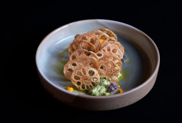 A plate of fusion Japanese food topped with fried lotus chips © Shōtō