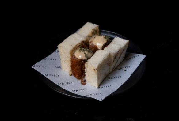 A wagyu “sando”, a sandwich made on fluffy white bread with crumbed wagyu inside © Shōtō 