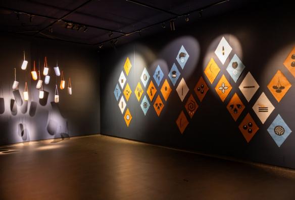 Artworks are displayed inside a cultural centre. © Larrakia Cultural Centre