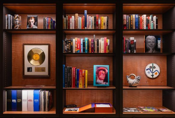 Golden records, rare books, magazines and artefacts all dedicated to the music of David Bowie line a collection of shelves. © MONA/Jesse Hunniford