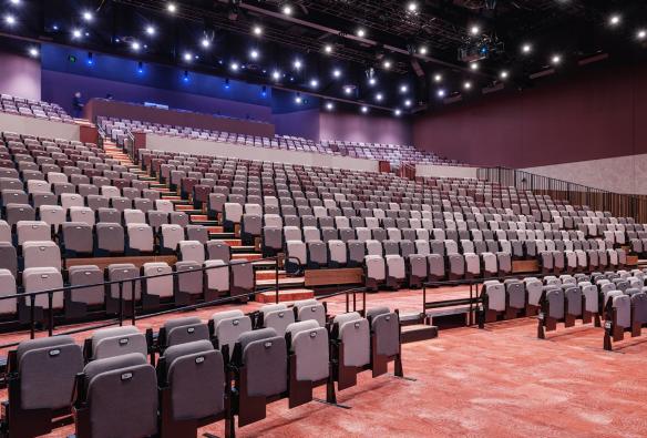 A dimly lit auditorium with lights and audio equipment sits empty, ready for an event. © Nic Stephens / Nyaal Banyul Geelong Convention and Event Centre