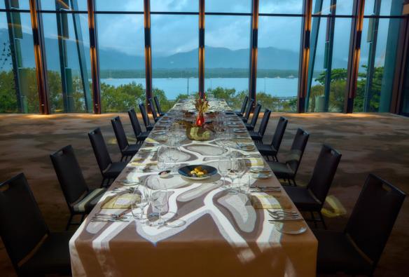 A table with a view at the Cairns Convention Centre, with the mood set to enjoy Burii, the Aboriginal and Torres Strait Islander dining experience. © Cairns Convention Centre