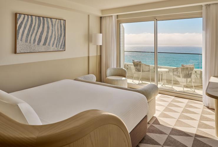The inside of a hotel room, with a balcony overlooking the ocean, InterContinental Sydney Coogee Beach, Sydney, New South Wales © Tourism Australia 