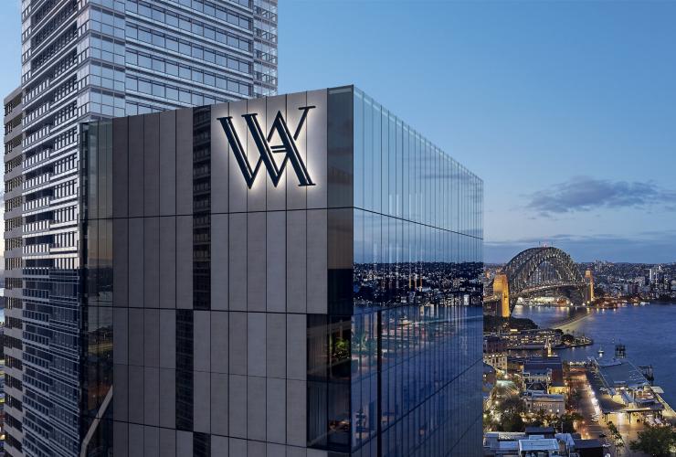 Render of a glass building that is overlooking Sydney Harbour with the Sydney Opera House and the Sydney Harbour Bridge, Waldorf Astoria, Sydney, New South Wales © Waldorf Astoria
